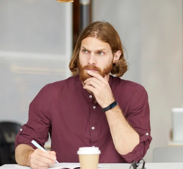 pensive businessman planning his work 92TDLSQ e1627780201129